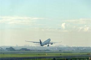 Airplane jet while taking off photo