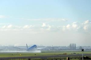 Airplane jet while taking off photo