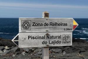 Lajido village Pico Island Azores black lava houses red windows photo