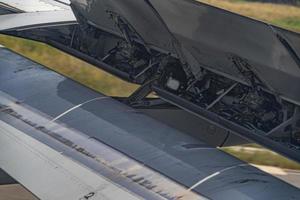 Airplane flap detail while landing photo