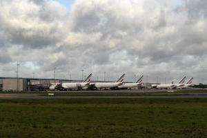 PARIS, FRANCE - NOVEMBER 7 2019 - Paris airport CDG landing and loading cargo and passenger photo