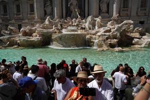 ROME, ITALY - JUNE 10 2018 - Trevi Fountain crowded of tourists photo