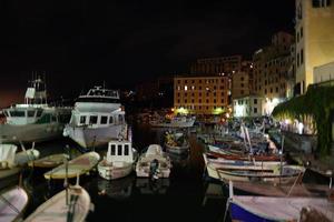 Camogli, Liguria, Italy picturesque fishermen village painted houses at night photo