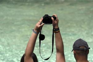 Tourist taking selfie at Fontana di Trevi fountain Rome photo