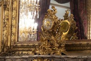 antique gold table clock from france photo