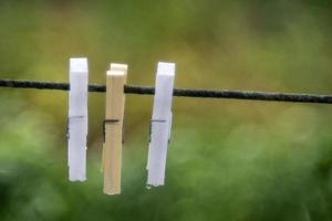 clothespin detail isolated on bubble green bokeh photo