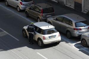 GENOA, ITALY - APRIL 9 2020 - Local police control during coronavirus covid quarentine photo