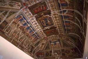 FERRARA, ITALY - SEPTEMBER 29 2018 - Medieval paintings in Estense Castle in Ferrara Italy under restoration photo