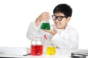 Elementary school boys wear white clothes, doing science experiments in the laboratory. Concept of child education development. isolated photo