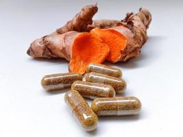 Capsules made from turmeric. photo