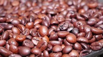 Freshly roasted coffee beans close up photo