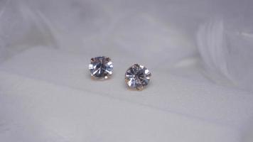 Beautiful gold earrings close-up on a white background photo