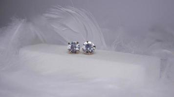 Beautiful gold earrings close-up on a white background photo