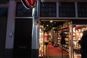 AMSTERDAM, NETHERLAND - FEBRUARY 25 2020 - Red light district in the old town photo