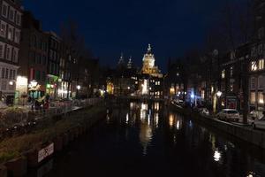 AMSTERDAM, NETHERLAND - FEBRUARY 25 2020 - Red light district in the old town photo