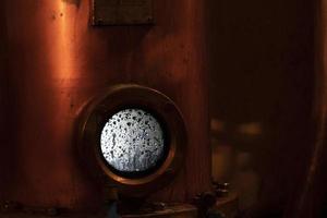 Copper alambic inside distillery photo