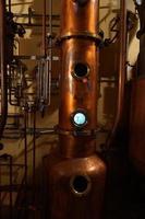 Copper alambic inside distillery photo