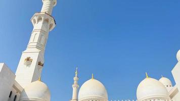 Abu dhabi, UAE, 2022 - tilt down view pool pond by Sheikh Zayed Grand Mosque pillars and Abu Dhabi Interior exterior details video