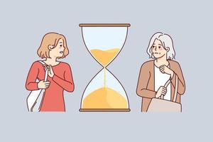 Young and old woman with hourglass between them. Concept of fast life and aging. Female life cycle. Vector illustration.