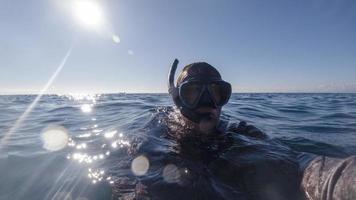 Snorkelist in Mediterranean Sea, Genoa, Italy photo