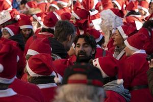 GENOA, ITALY - DECEMBER 22 2019 - Traditional Santa claus walk photo