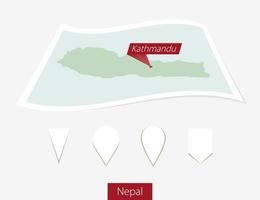 Curved paper map of Nepal with capital Kathmandu on Gray Background. Four different Map pin set. vector