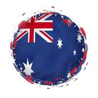 Round grunge flag of Australia with splashes in flag color. vector