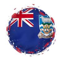 Round grunge flag of Falkland Islands with splashes in flag color. vector