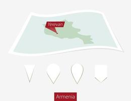 Curved paper map of Armenia with capital Yerevan on Gray Background. Four different Map pin set. vector