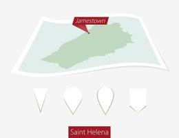 Curved paper map of Saint Helena with capital Jamestown on Gray Background. Four different Map pin set. vector