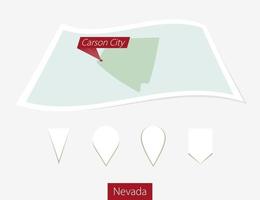 Curved paper map of Nevada state with capital Carson City on Gray Background. Four different Map pin set. vector