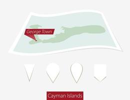 Curved paper map of Cayman Islands with capital George Town on Gray Background. Four different Map pin set. vector