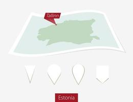 Curved paper map of Estonia with capital Tallinn on Gray Background. Four different Map pin set. vector