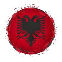 Round grunge flag of Albania with splashes in flag color. vector