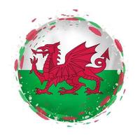 Round grunge flag of Wales with splashes in flag color. vector