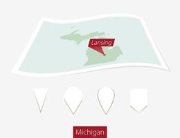 Curved paper map of Michigan state with capital Lansing on Gray Background. Four different Map pin set. vector