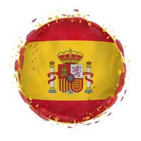 Round grunge flag of Spain with splashes in flag color. vector