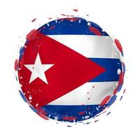 Round grunge flag of Cuba with splashes in flag color. vector