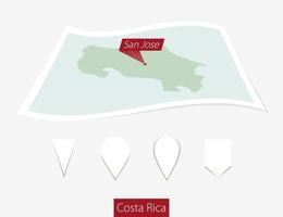 Curved paper map of Costa Rica with capital San Jose on Gray Background. Four different Map pin set. vector