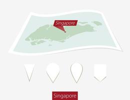 Curved paper map of Singapore on Gray Background. Four different Map pin set. vector