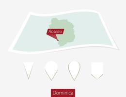 Curved paper map of Dominica with capital Roseau on Gray Background. Four different Map pin set. vector