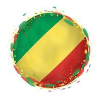 Round grunge flag of Congo with splashes in flag color. vector