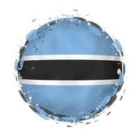 Round grunge flag of Botswana with splashes in flag color. vector