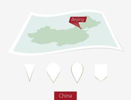 Curved paper map of China with capital Beijing on Gray Background. Four different Map pin set. vector