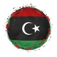 Round grunge flag of Libya with splashes in flag color. vector