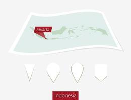 curvo papel mapa de Indonesia con capital Jacarta en gris antecedentes. cuatro diferente mapa alfiler colocar. vector