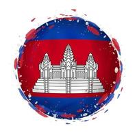 Round grunge flag of Cambodia with splashes in flag color. vector