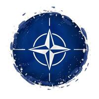 Round grunge flag of Nato with splashes in flag color. vector