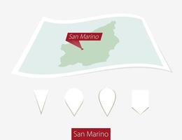 Curved paper map of San Marino with capital San Marino on Gray Background. Four different Map pin set. vector