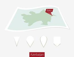 Curved paper map of Azerbaijan with capital Baku on Gray Background. Four different Map pin set. vector